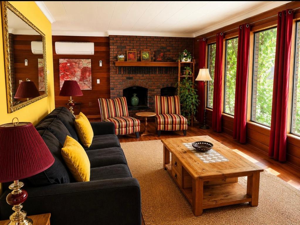 a living room with a couch and a table at The Country Barn in Port Alberni