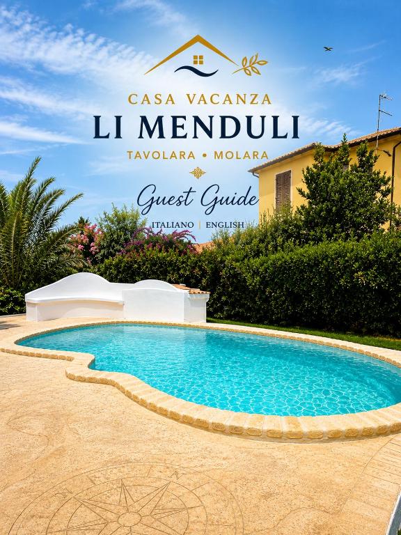 a swimming pool in front of a villa at Casa Vacanza Li Menduli San Teodoro in San Teodoro