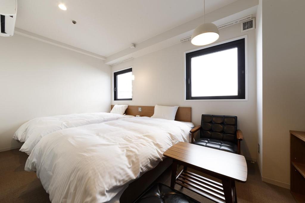 Postel nebo postele na pokoji v ubytování Hotel Citio Shizuoka