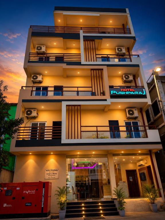 a tall building with speakers on the side of it at Hotel Pushparaj Puri - Beach front Hotel near Light House - Sea Facing AC Rooms - with Restaurant, Parking Facilities in Puri