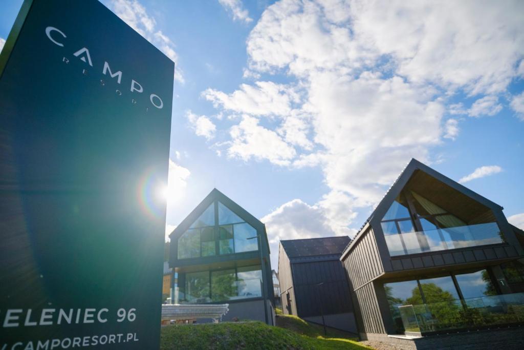 a sign in front of a building at Campo Resort in Duszniki Zdrój