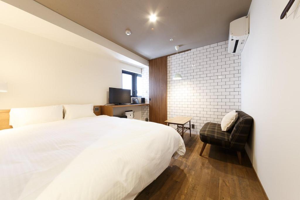 Postel nebo postele na pokoji v ubytování Hotel Citio Shizuoka