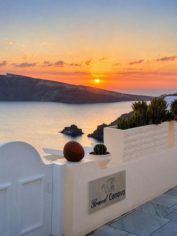 a view of the sunset from the terrace of a resort at Grand Canava in Oia