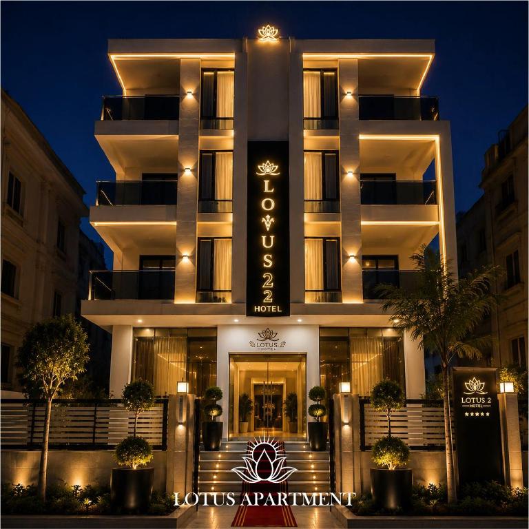 a hotel building with a sign in front of it at Lotus Two Hotel l New Cairo in Cairo