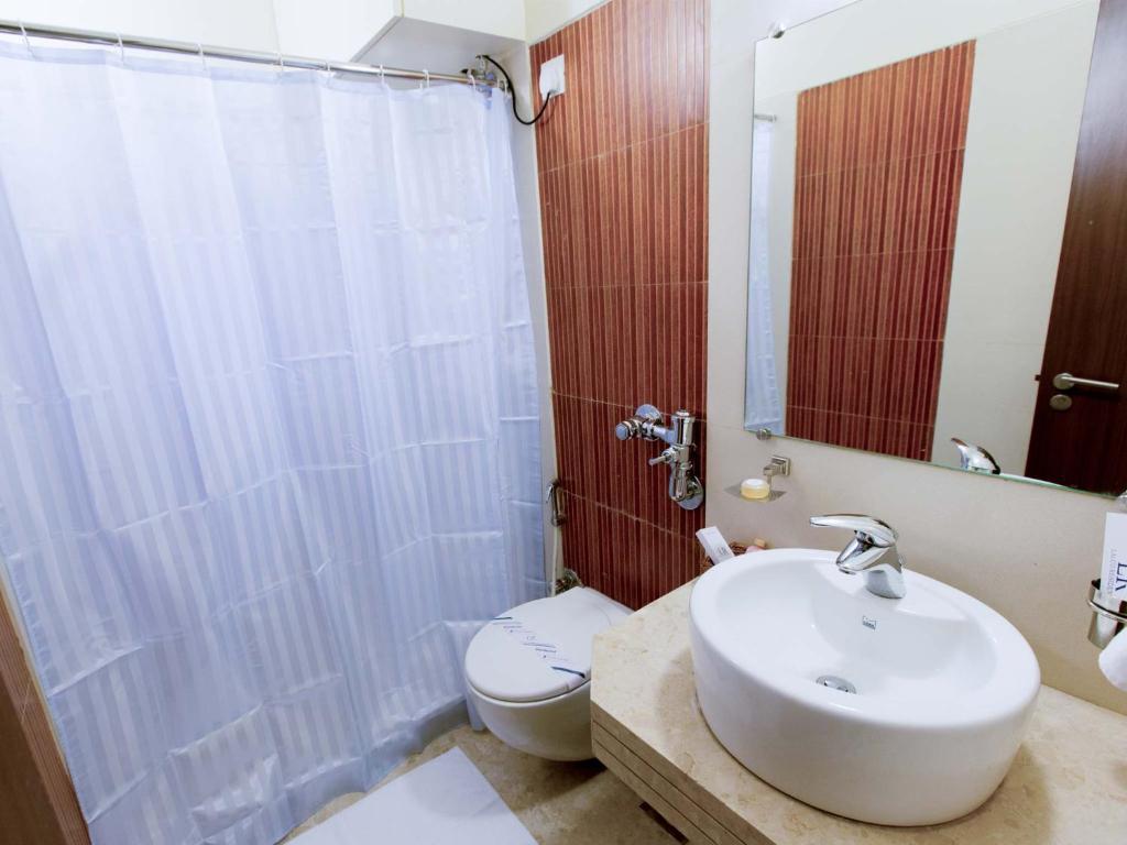 Koupelna v ubytování Lalco Residency