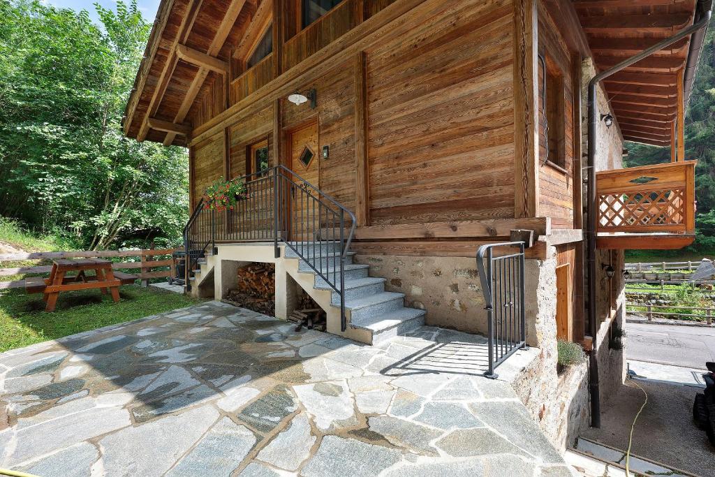 a house with a staircase on the side of it at Maso Rubino in Rabbi