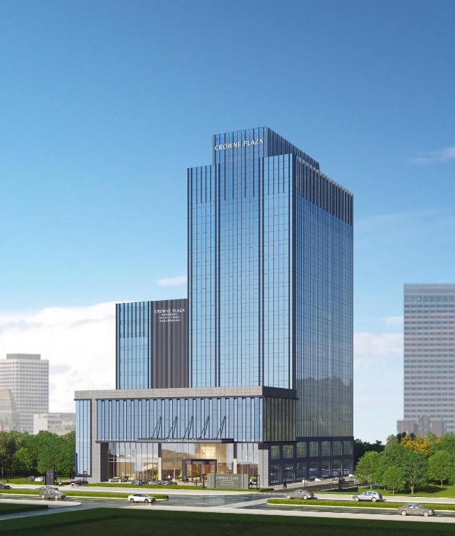 a rendering of a tall glass building in a city at Crowne Plaza Dalian Kerren in Dalian