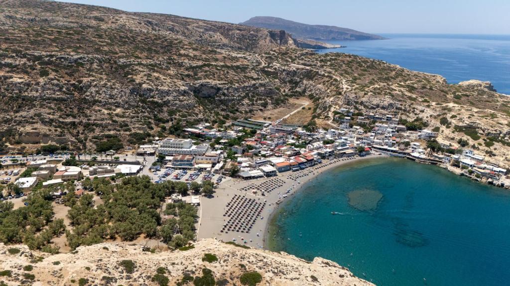an aerial view of a beach on a hill at Khōra Suites Matala in Matala