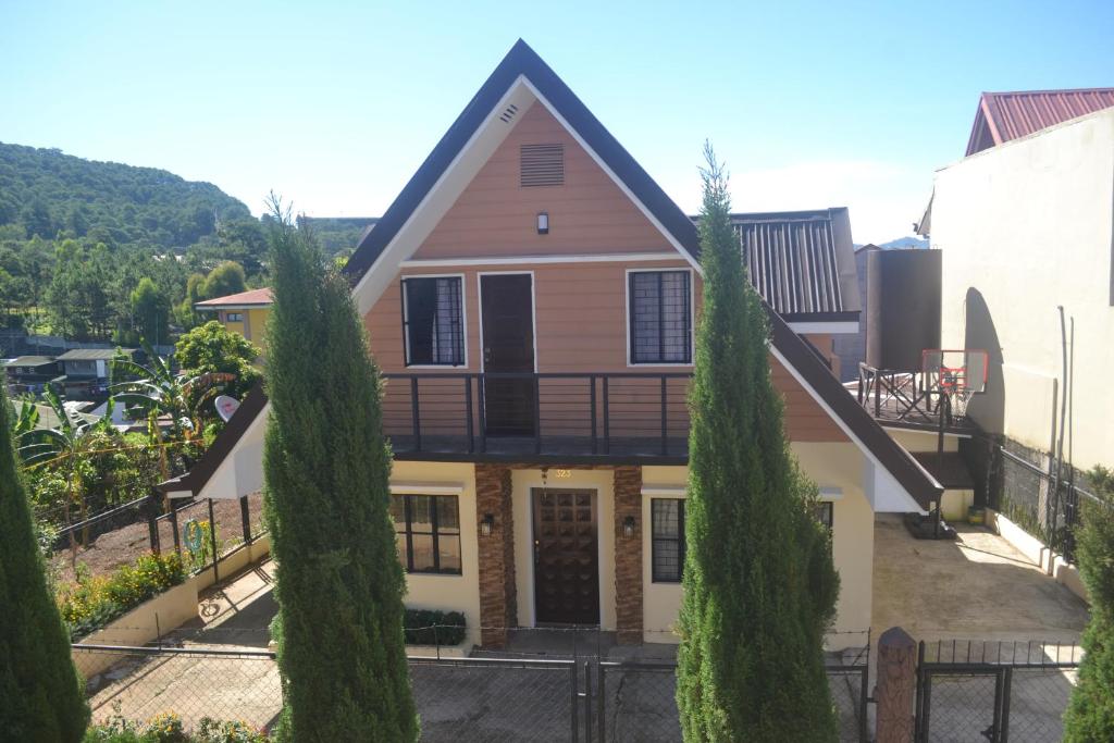 a house with trees in front of it at Zya 3BR A-House in Baguio