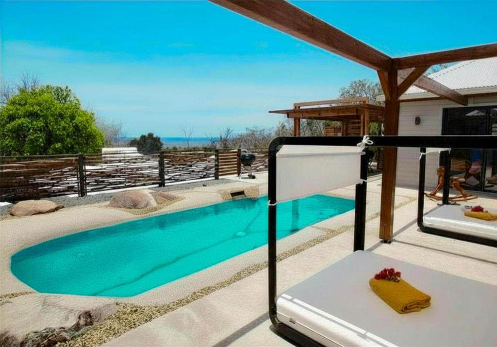 a swimming pool in the middle of a house at EDEN FOREST VILLA in Pointe-Noire