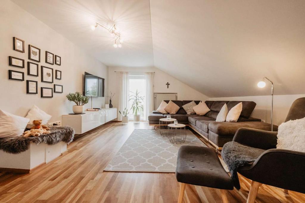 a living room with a couch and a table at Haus Heidi in Freyung