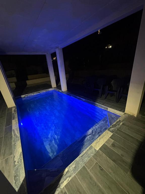 a swimming pool in a house at night at Villa 280 m2 in Sète