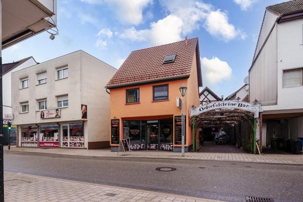 a group of buildings on a city street at Haus Hauptstrasse 23a in Bühl