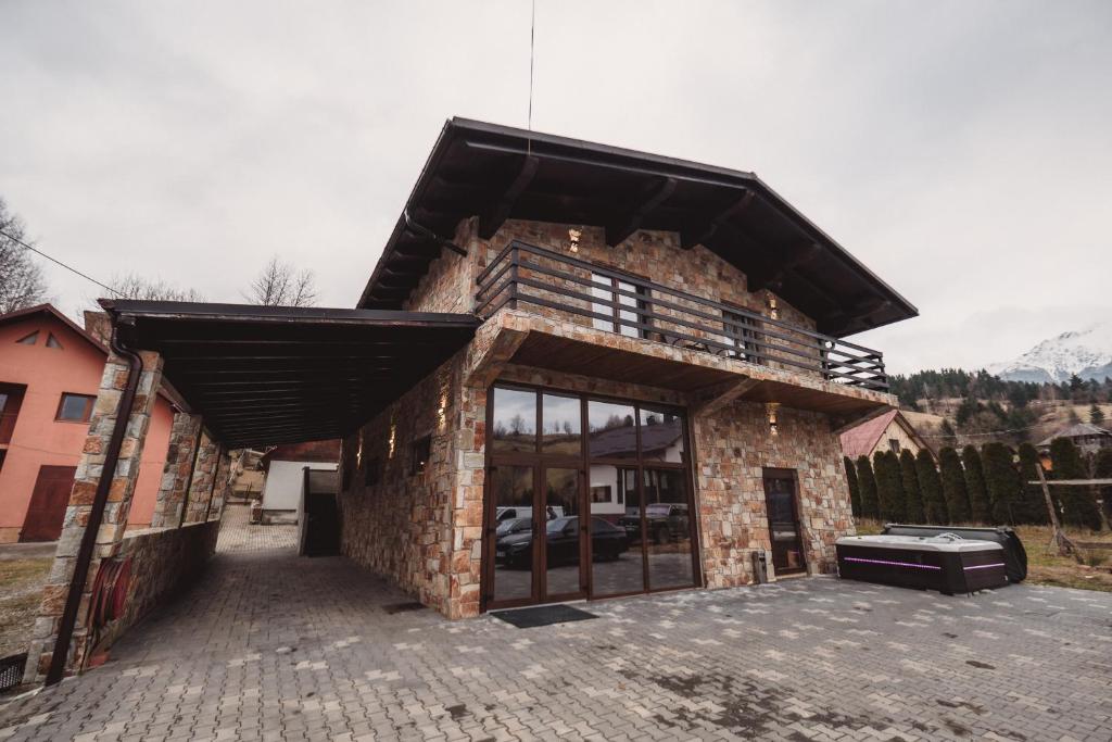 a large brick building with a large window at Alpine Retreat in Borsa