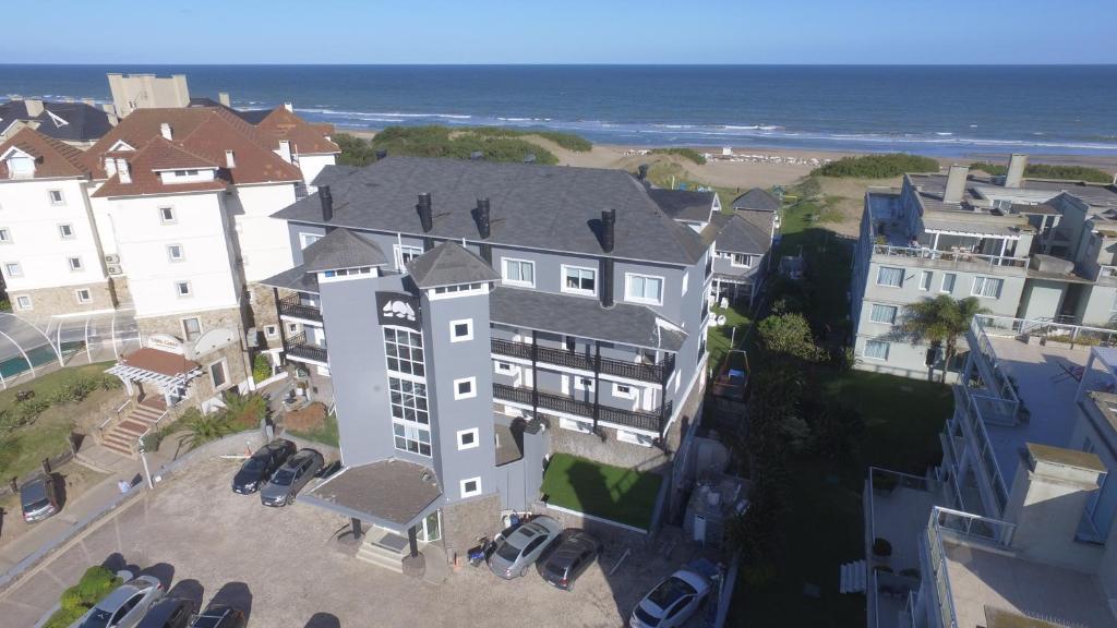 an aerial view of a large house and the ocean at Torrecillas Carilo in Carilo