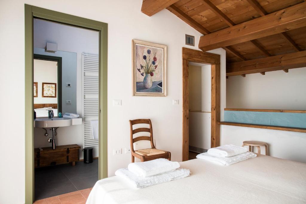 Postel nebo postele na pokoji v ubytování Agriturismo Corte Ruffoni