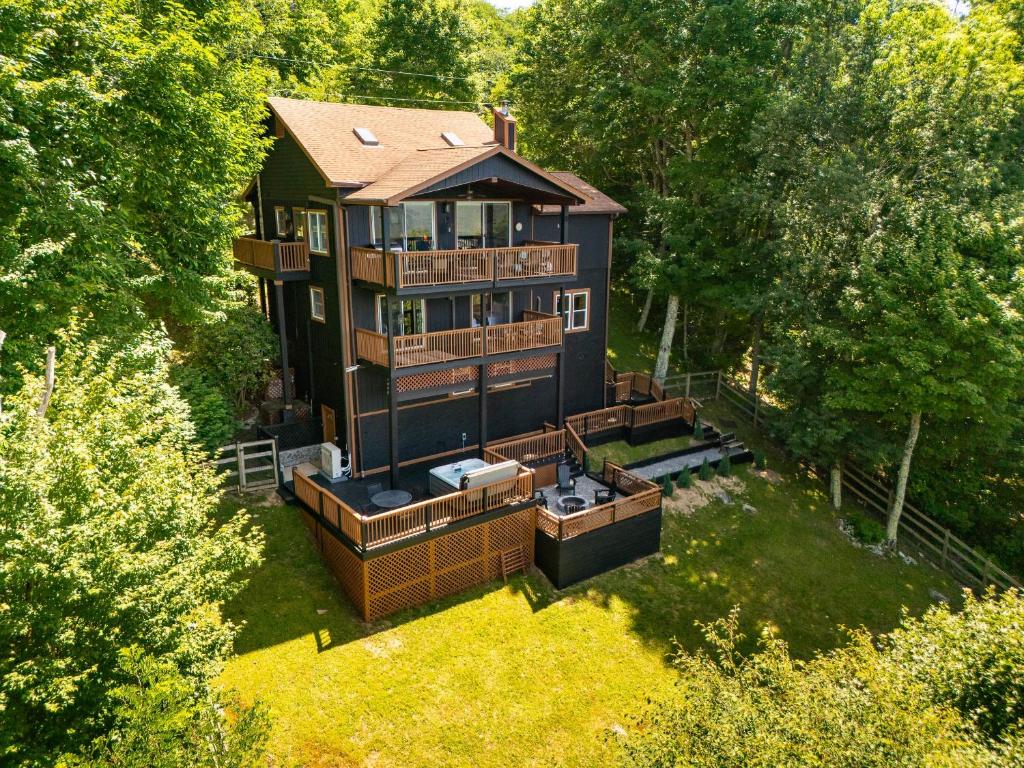an aerial view of a large house with a yard at Grey Fox in Banner Elk