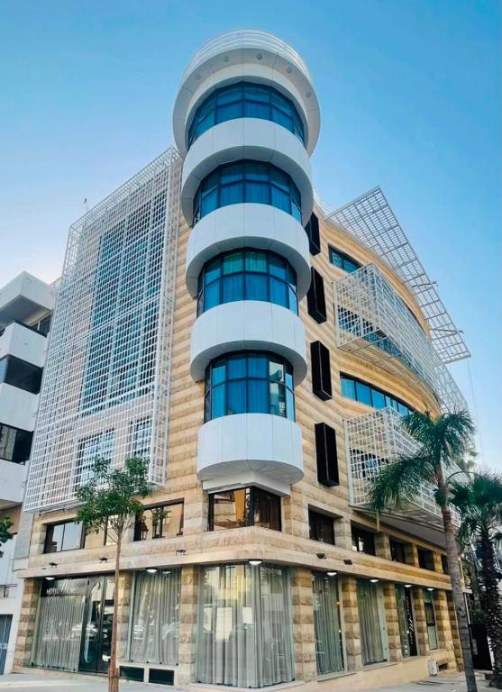 a tall building with a round window at Le M Neo in Rabat