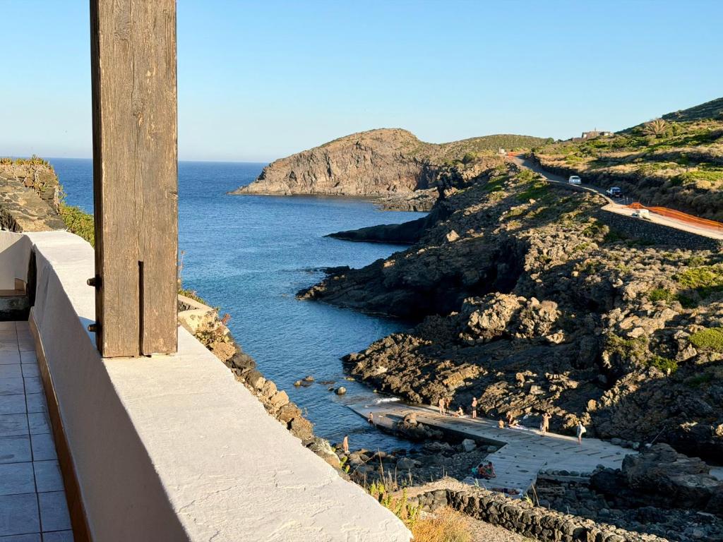 a view of the ocean from a building at Dammuso Ziloto - Cala Levante & Arco dell'Elefante in Pantelleria
