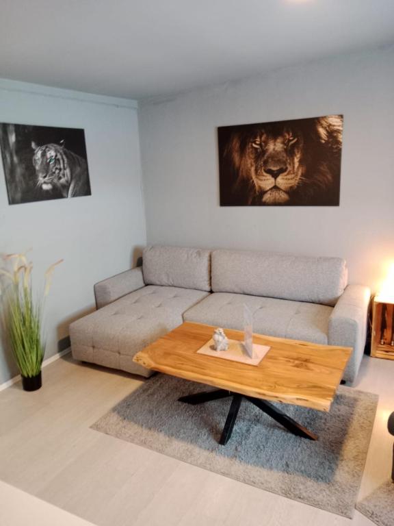 a living room with a couch and a table at Stadtnest Katharine in Flensburg