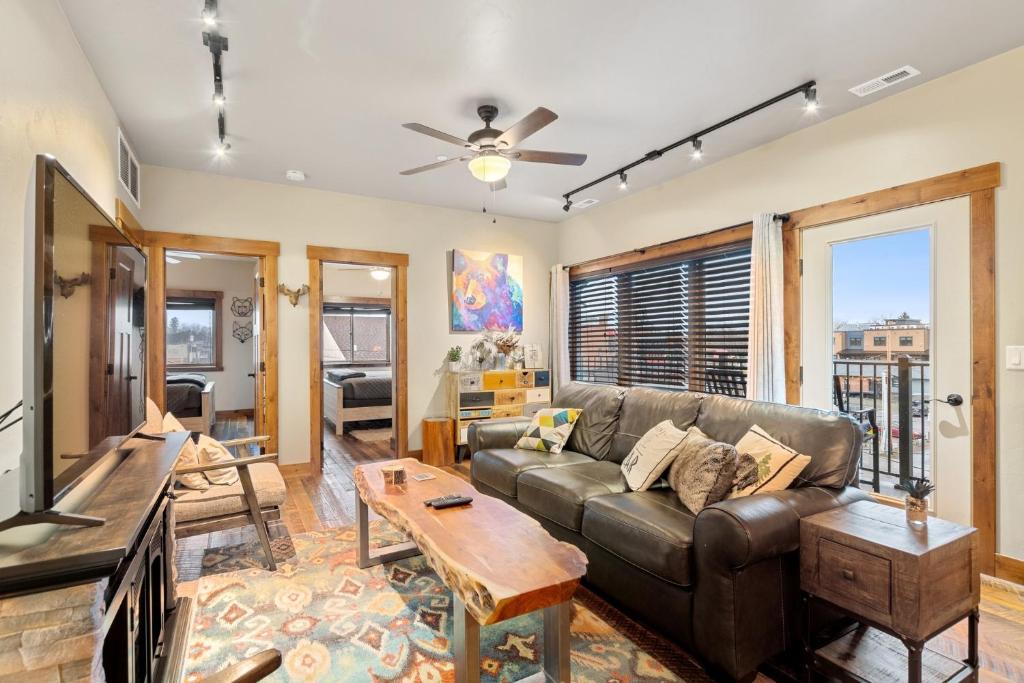 a living room with a couch and a table at Baker Loft 301 in Whitefish