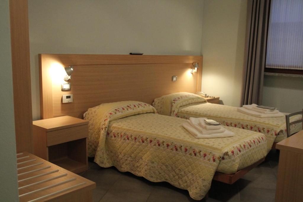 Posteľ alebo postele v izbe v ubytovaní Albergo Verdi