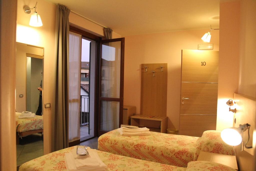 Posteľ alebo postele v izbe v ubytovaní Albergo Verdi