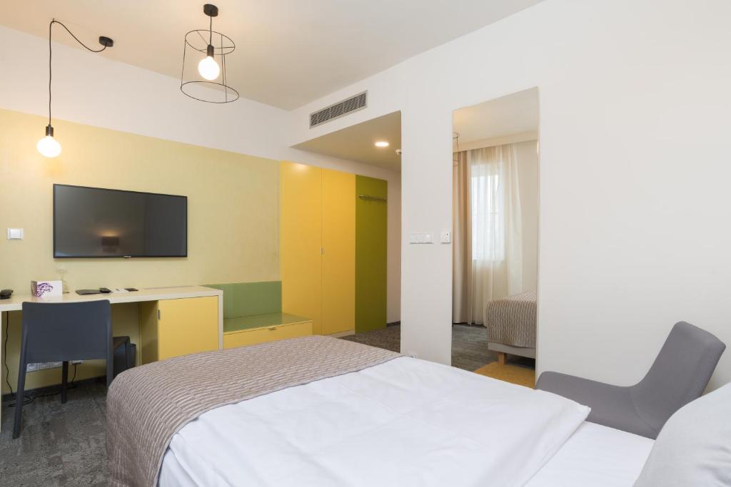 Postel nebo postele na pokoji v ubytování Fairhotel