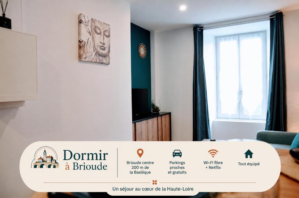 a sign in a room with a living room at Dormir à Brioude - appartement 'esprit zen' in Brioude