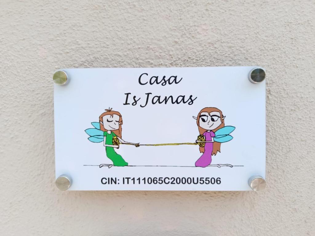 a sign on a wall that reads casa is tamales at Casa IS JANAS in San Sperate