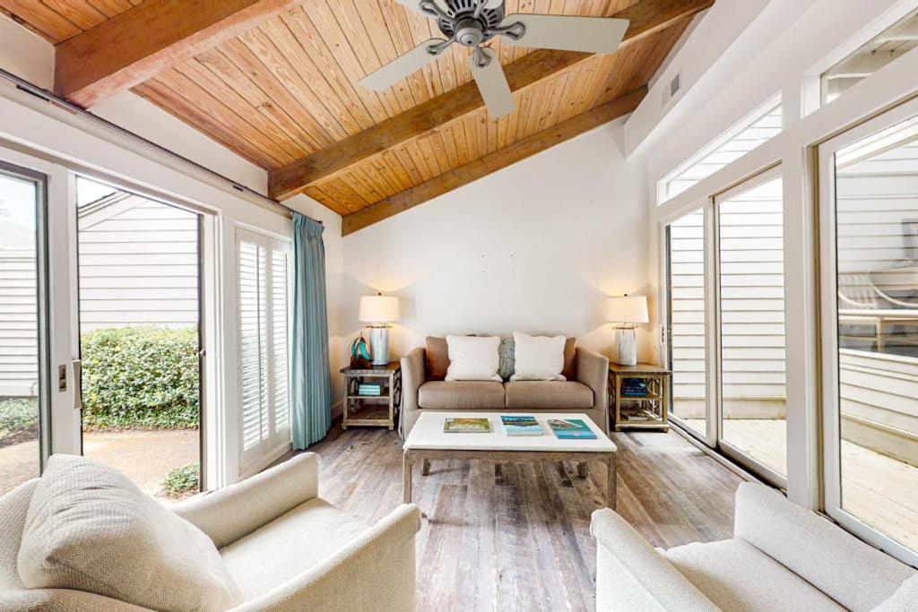 a living room with a couch and a ceiling fan at Twin Oaks 207 in Hilton Head Island