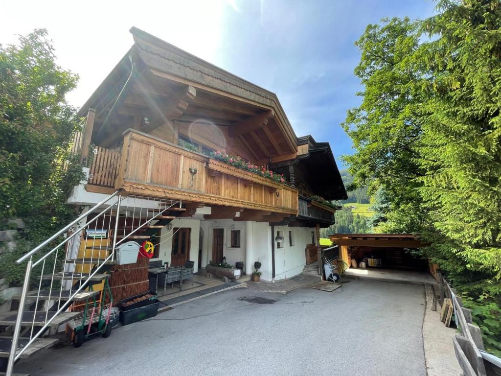 a house being constructed with a balcony on top of it at Ferienwohnung Sonnheim Alpbachtal Card inklusive in Alpbach