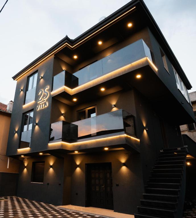 a large house with lights on the side of it at 2S Vila Boutique Pogradec in Pogradec