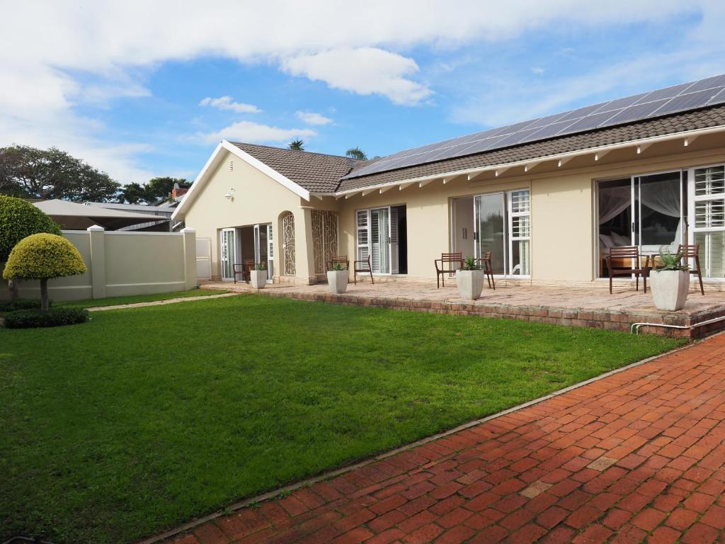 a house with a lawn in front of it at Keiskama B & B in Port Elizabeth