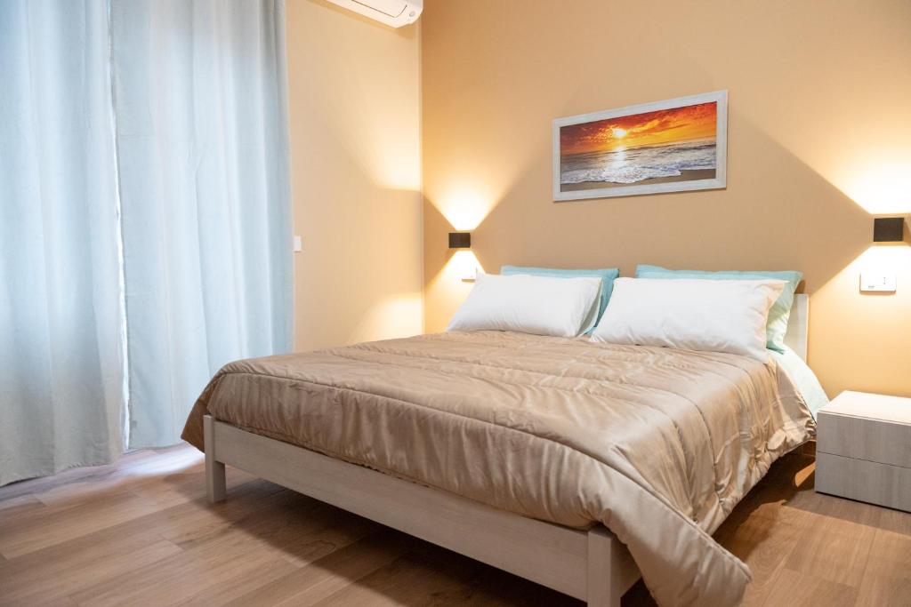 a bedroom with a large bed in a room at B&B Civico 15 in Nettuno