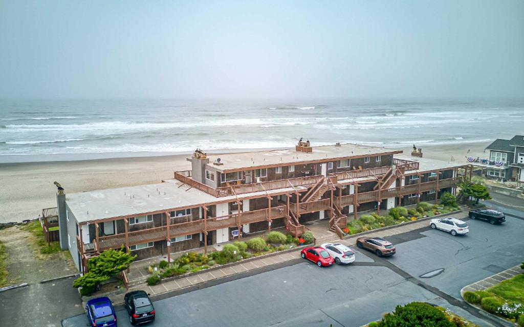 a hotel with cars parked in front of the beach at Pacific Sands Unit #10 in Neskowin