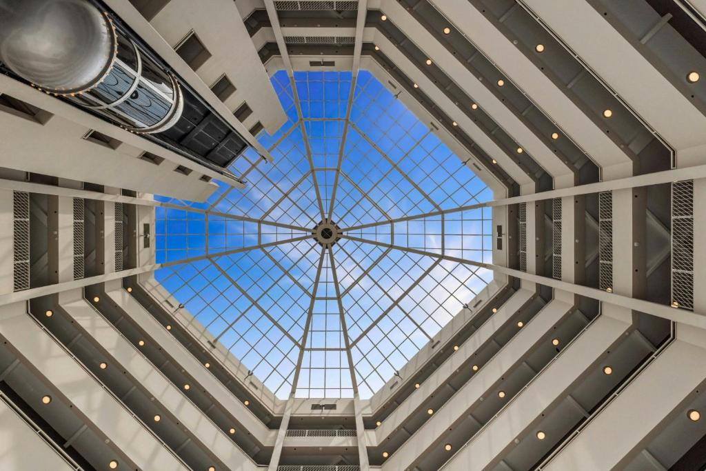 a view from the inside of a building with a glass ceiling at The Arlin, Arlington, a Tribute Portfolio Hotel in Arlington