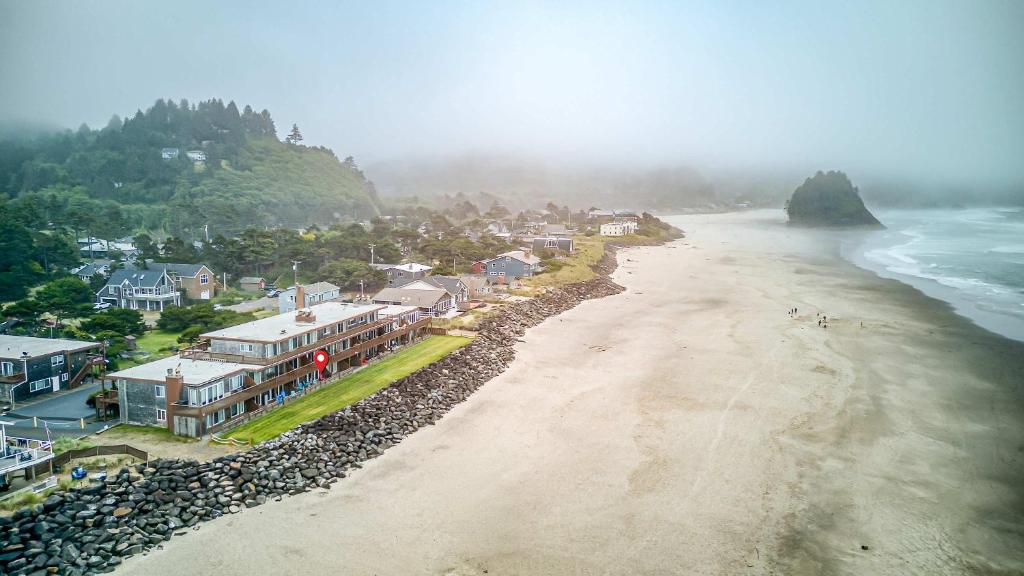 an aerial view of a beach with houses and the ocean at Waveside Hideaway, Unit 11 in Neskowin