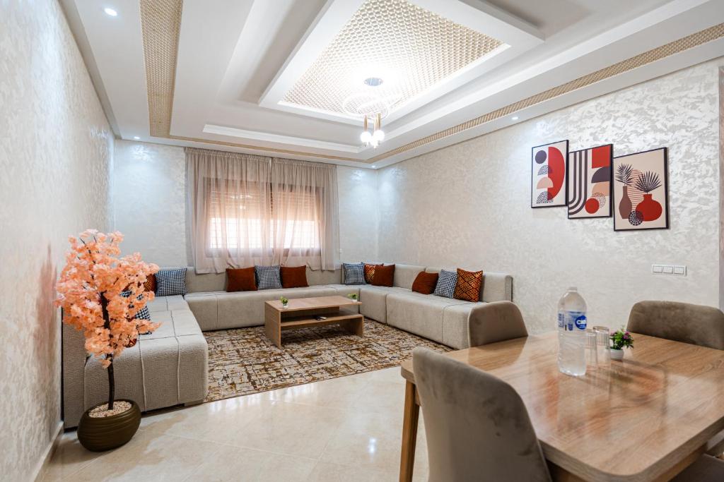 a living room with a couch and a table at Sahoria Stay in Dakhla
