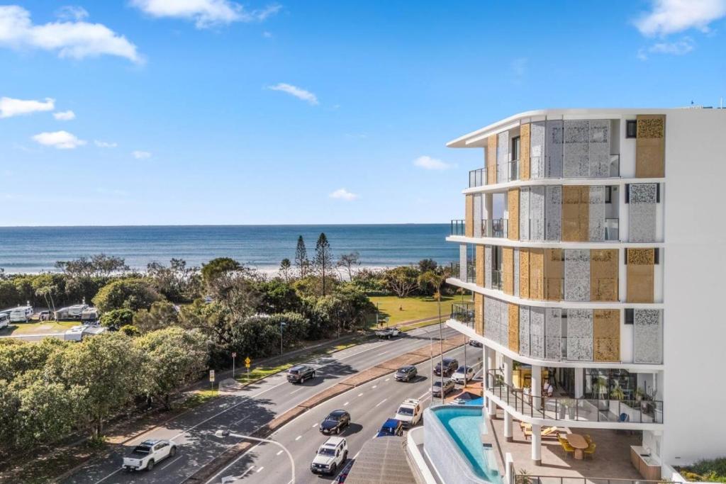 an apartment building with a view of the ocean at Sakara at Marochydore in Maroochydore