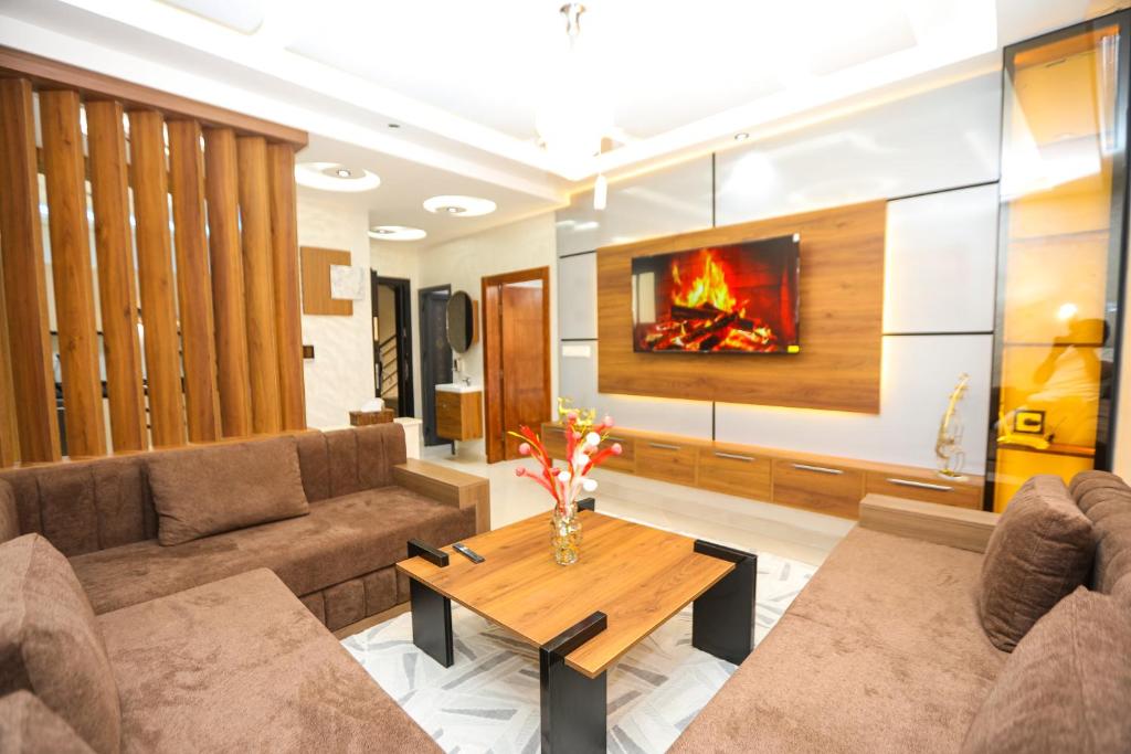 a living room with a couch and a table at Résidence Acharif in Tan-Tan Plage