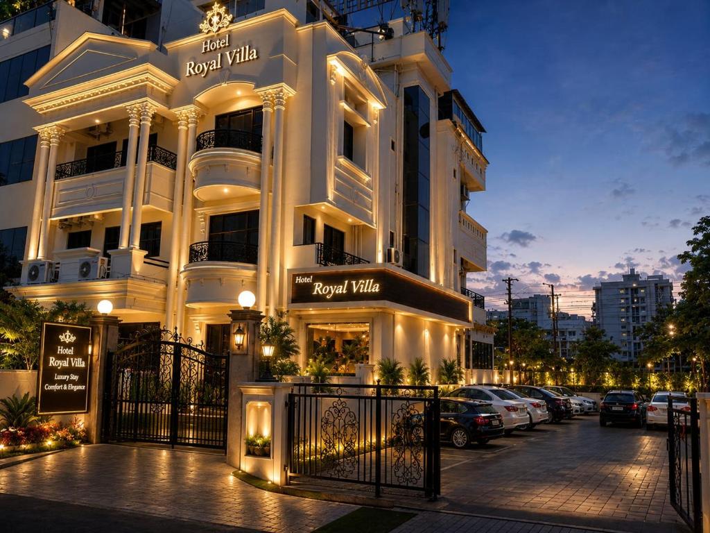 a white building with a parking lot in front of it at Hotel Royal Villa in Nagpur