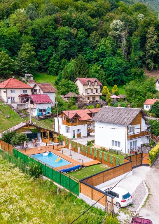 an aerial view of a house with a swimming pool at na obali drine in Perućac