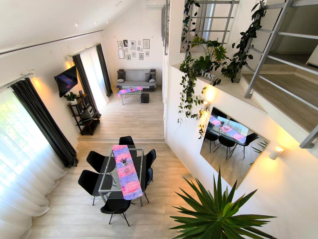 an overhead view of a living room with a table and chairs at Apartments and Rooms Minex in Trebinje