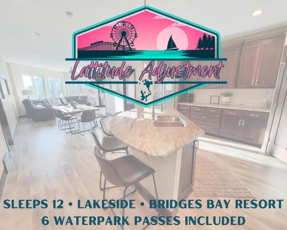 a restaurant with a counter with a bar in a kitchen at Bridges Bay Resort Bayside Building 203 in Arnolds Park