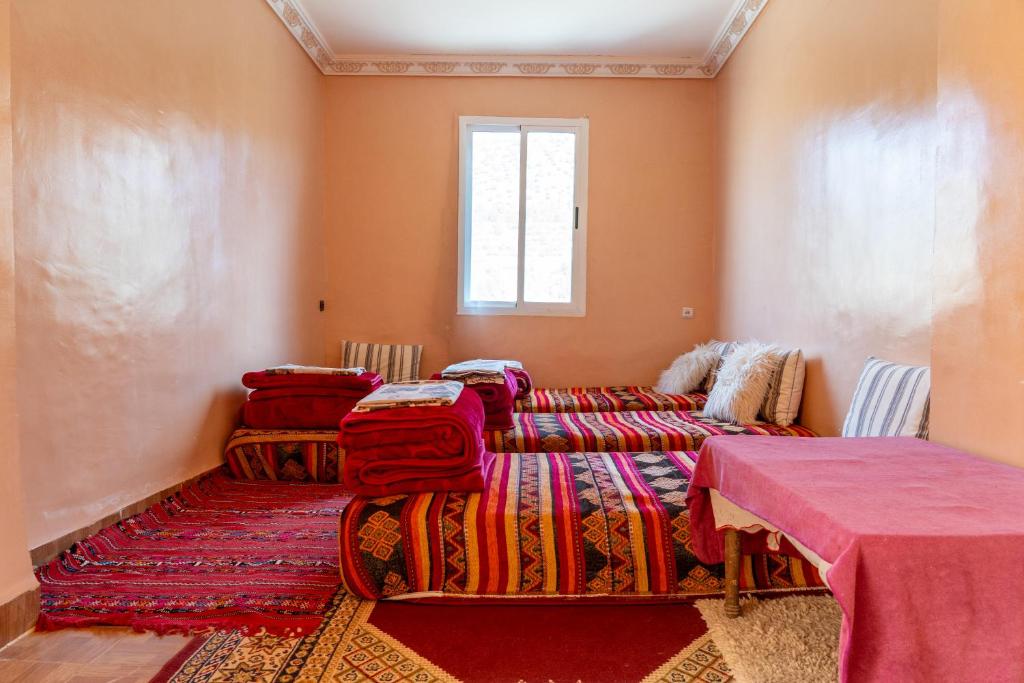 a room with two beds and a window at Atlas Sud panorama in Imlil