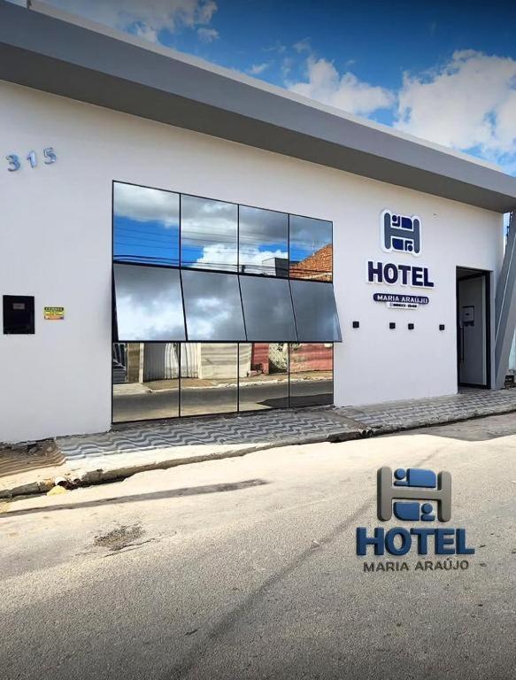 a hotel sign on the side of a building at Hotel maria araujo in Arapiraca