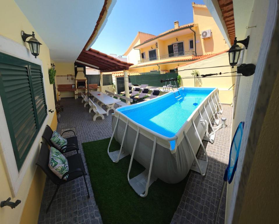 an overhead view of a swimming pool on a balcony at Marcio's Home in Fernao Ferro