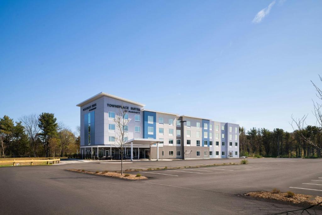 a large building with a parking lot in front of it at TownePlace Suites by Marriott Seekonk in Seekonk