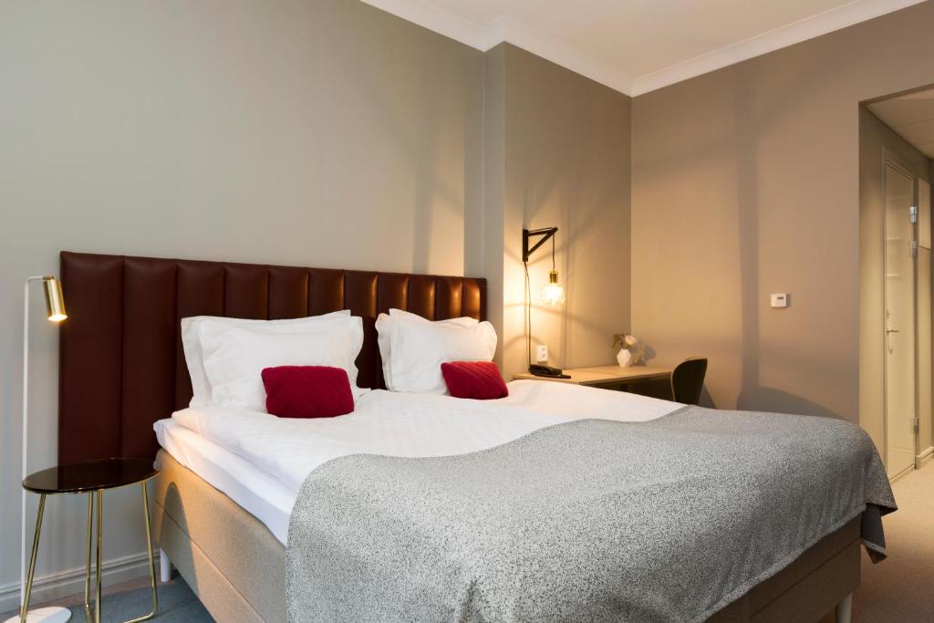 Postel nebo postele na pokoji v ubytování Elite Hotel Adlon